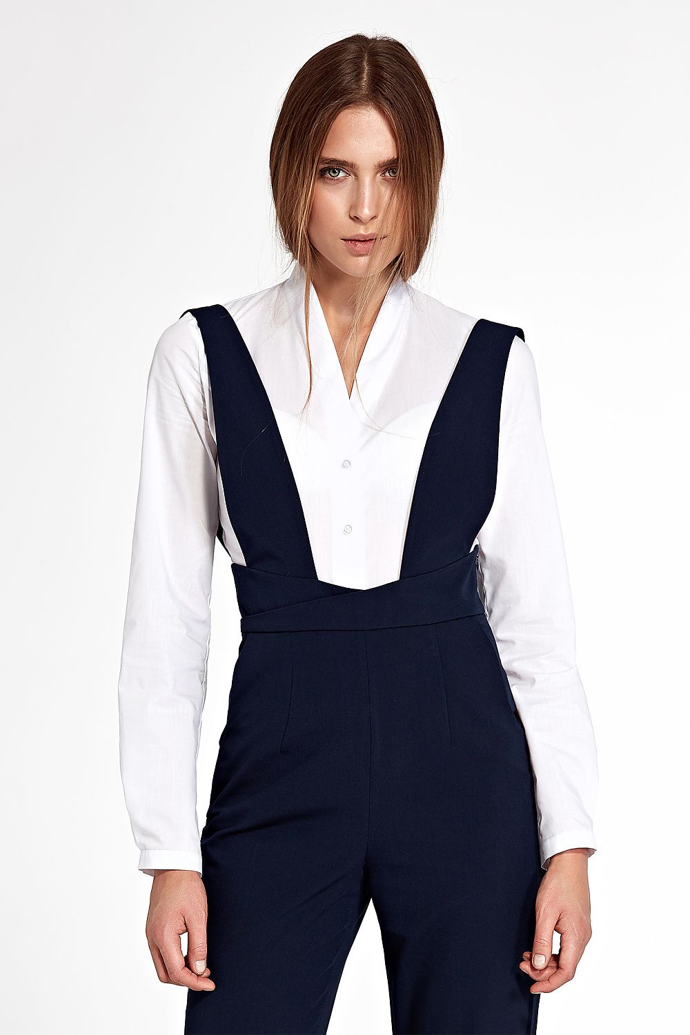 Sophisticated white bodysuit with long sleeves and no collar, crafted by Nife, ideal for pairing with classic trousers, skirts, and overalls.