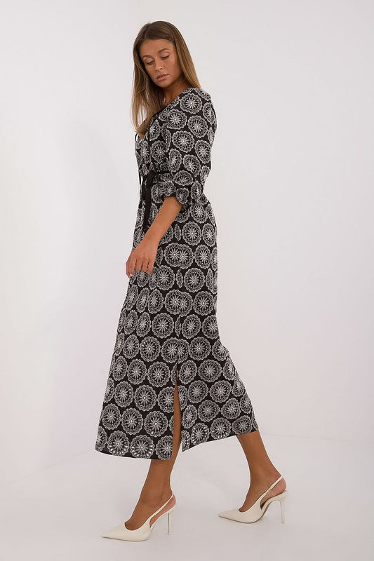 Romantic Lakerta cotton daydress with a tie waist and delicate ruffled sleeves, ideal for a chic cocktail look.