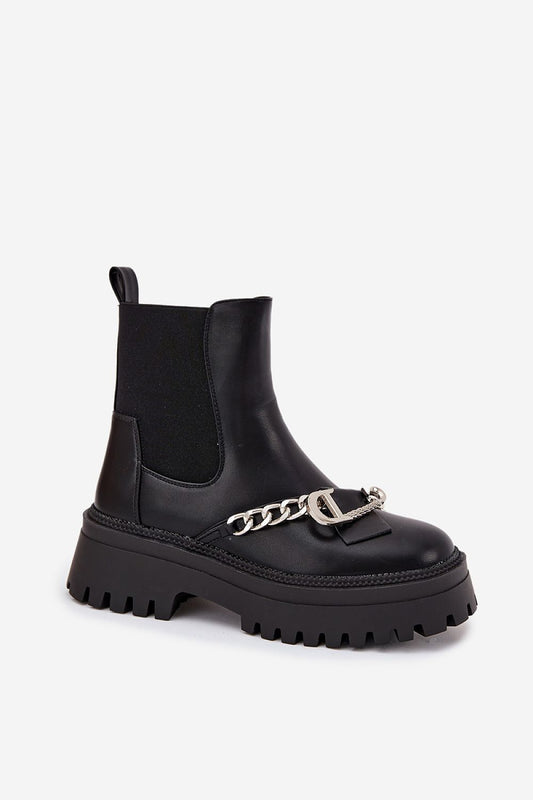 Elegant close-up of women's eco leather ankle boots featuring a plush faux fur interior and decorative chain detail, crafted by Step in Style for sophistication and comfort.