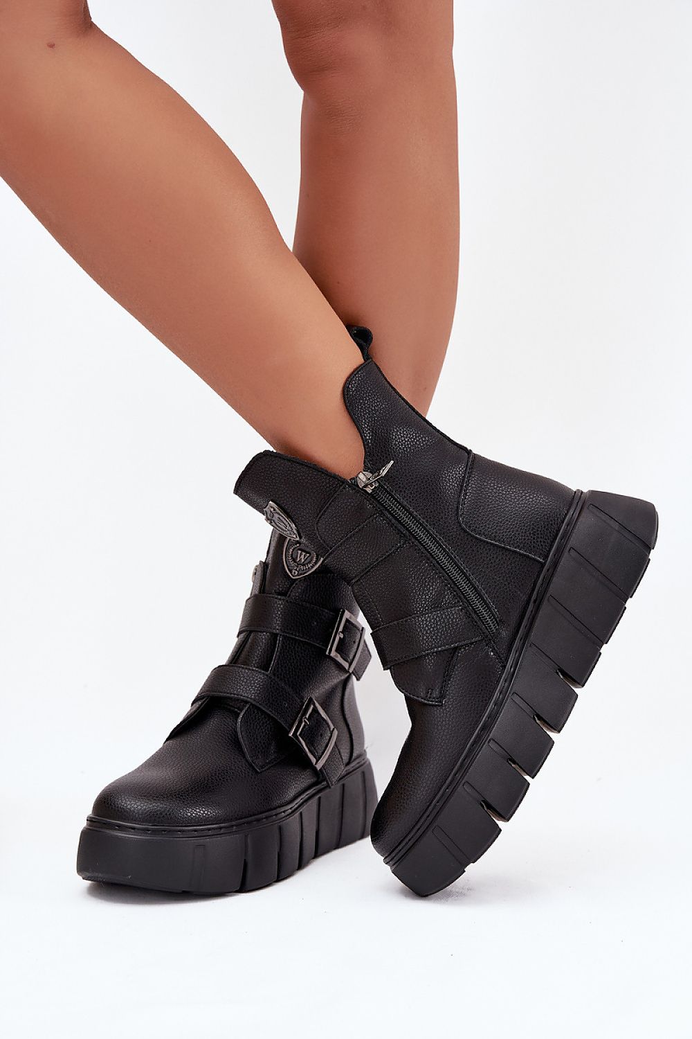 Vinceza Women's Luxury Leather Ankle Boots displayed on a polished surface, highlighting the sophisticated craftsmanship and comfort for colder days by Step in Style.