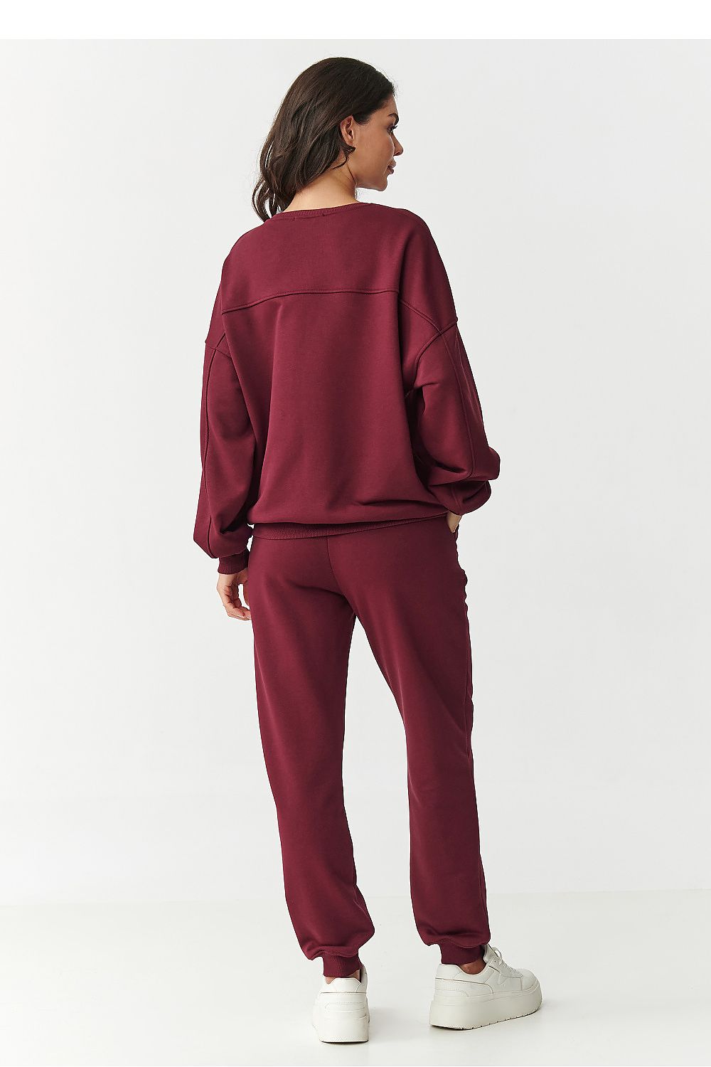 Stylish Makadamia tracksuit pants featuring elastic waistband and ribbed cuffs, made from high-quality cotton for ultimate comfort and luxury.