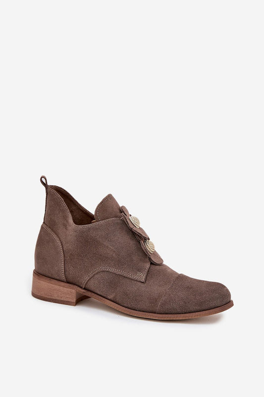 Stylish pair of elegant women's suede half shoes by Step in style, featuring delicate decorative flowers and a comfortable zipper design.