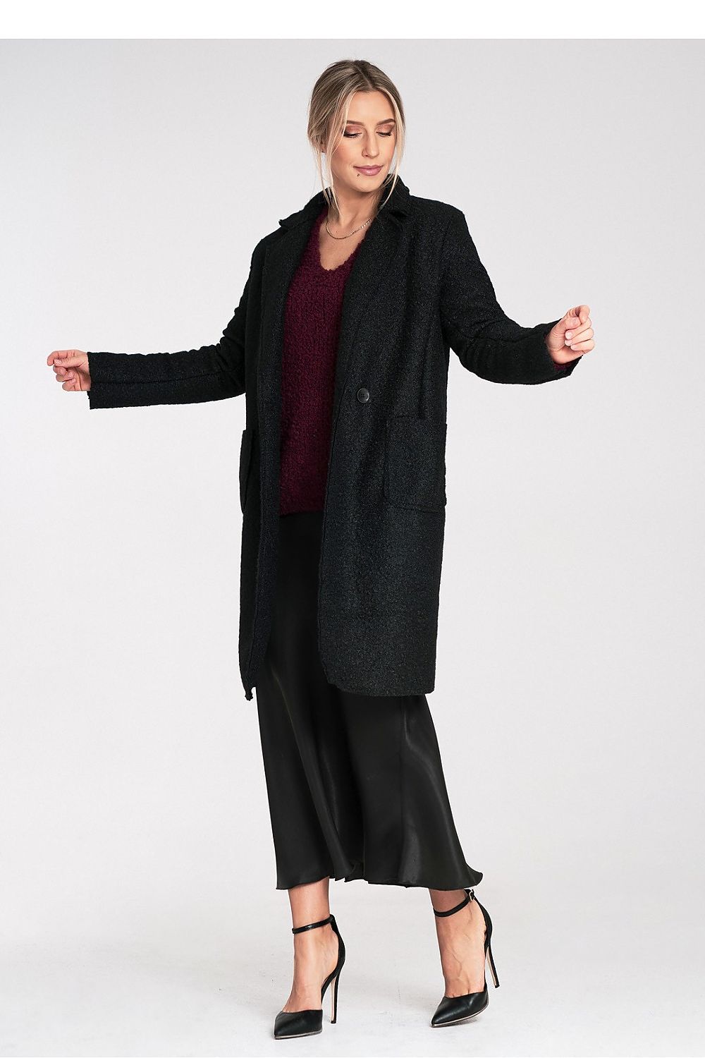 Elegant Figl Coat displayed elegantly, embodying luxury fashion with a perfect combination of comfort and style.