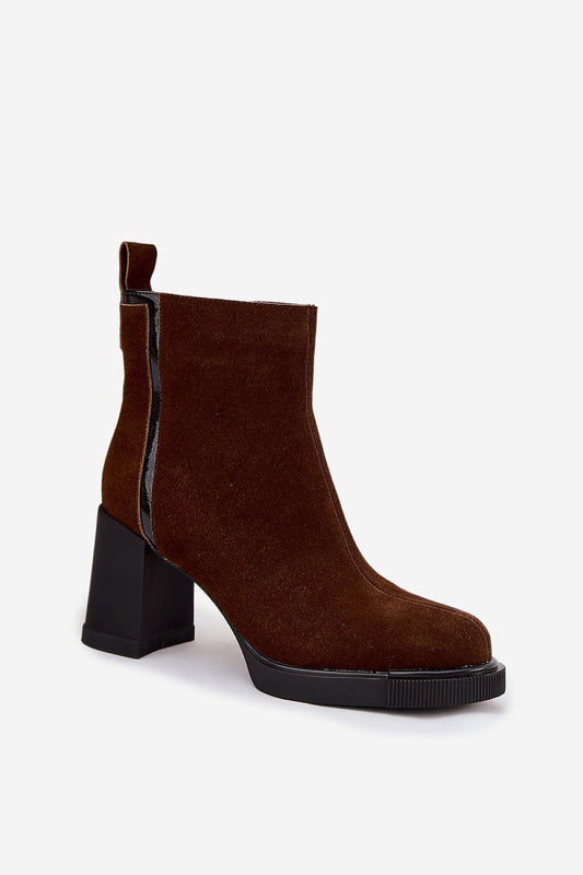 Side view of Step in Style's women's suede heel boots showcasing classic feminine silhouette and stylish zipper closure.