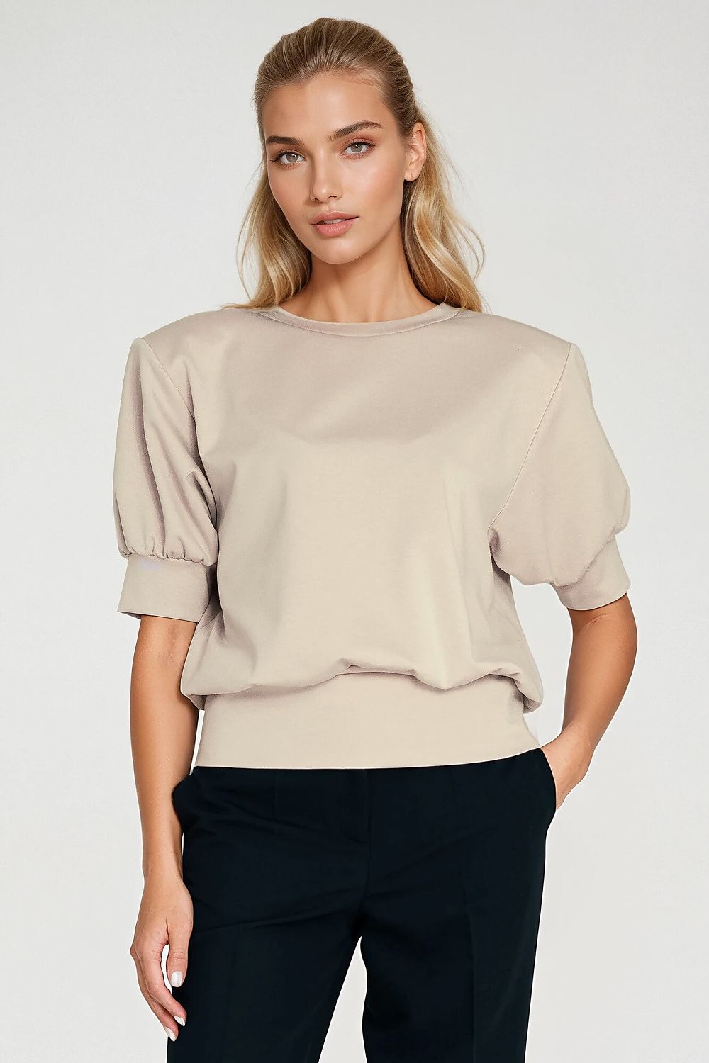 Nife oversized blouse displayed on a mannequin, illustrating the relaxed silhouette and luxurious feel of the fabric.