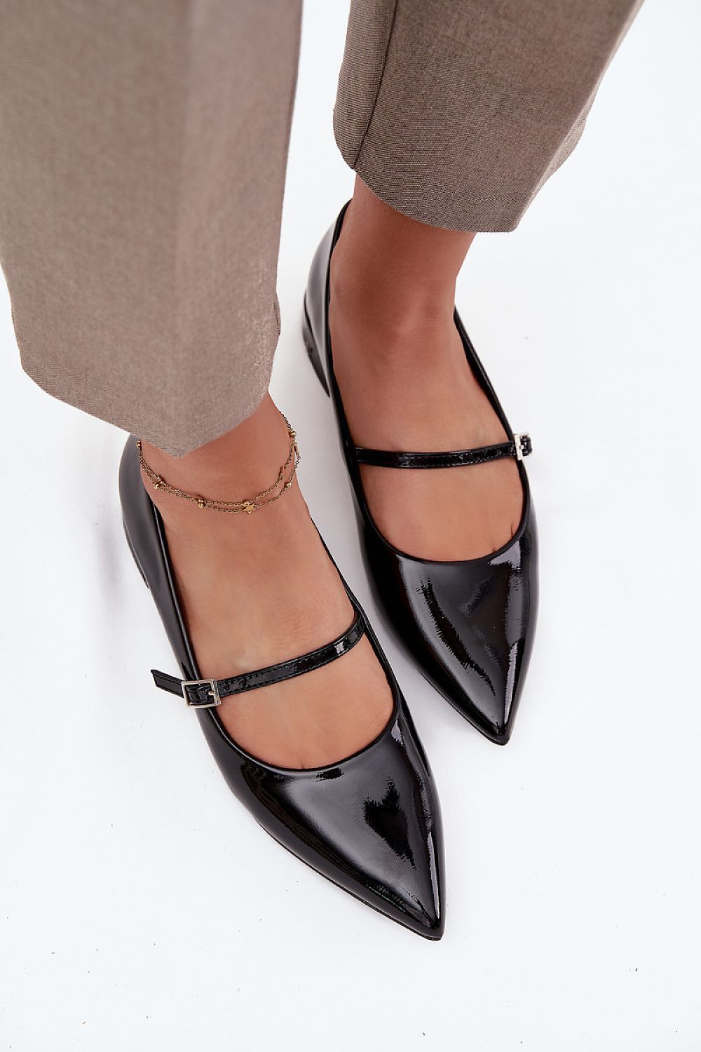 Elegant women's patent leather ballet flats by Step in Style featuring a low heel, pointed toes for a stylish look, and an instep strap for added stability; available in sizes EU 36-41.