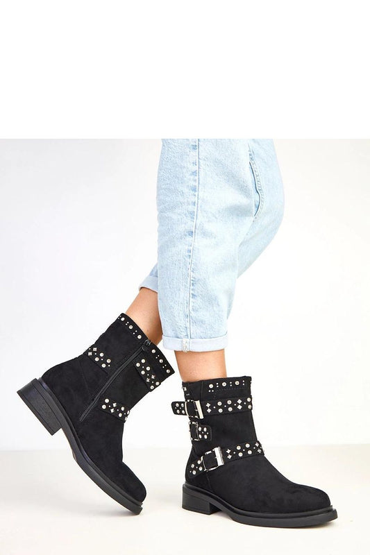 Close-up of Solea's eco suede ankle boots, showcasing the luxurious buckle and zircon embellishments that add a touch of elegance.