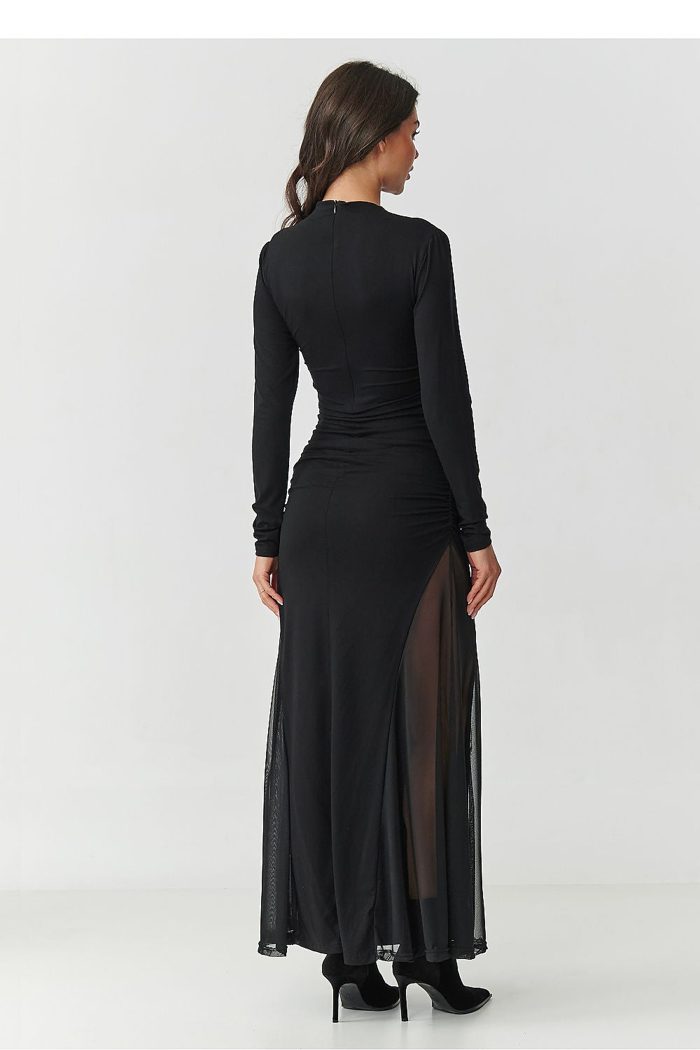 Elegant black maxi dress from Makadamia featuring deep tulle inserts, classic neck design, and a flattering fitted silhouette, perfect for special occasions.
