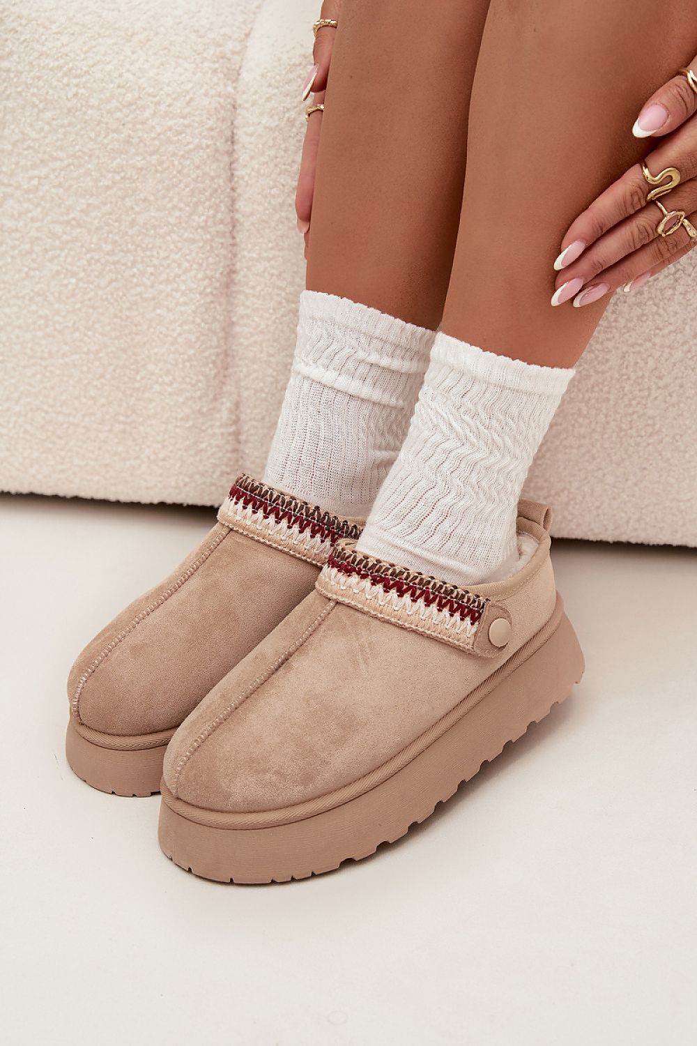 Chic and functional women's low snow boots with a stable platform by Step in Style, showcasing a fashionable removable strap for versatile wear.