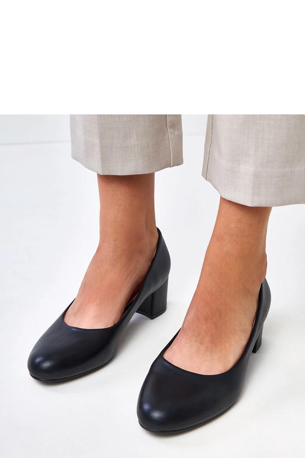 Versatile women's faux leather block heel pumps by Solea, suitable for both elegant and casual outfits, available in multiple sizes.