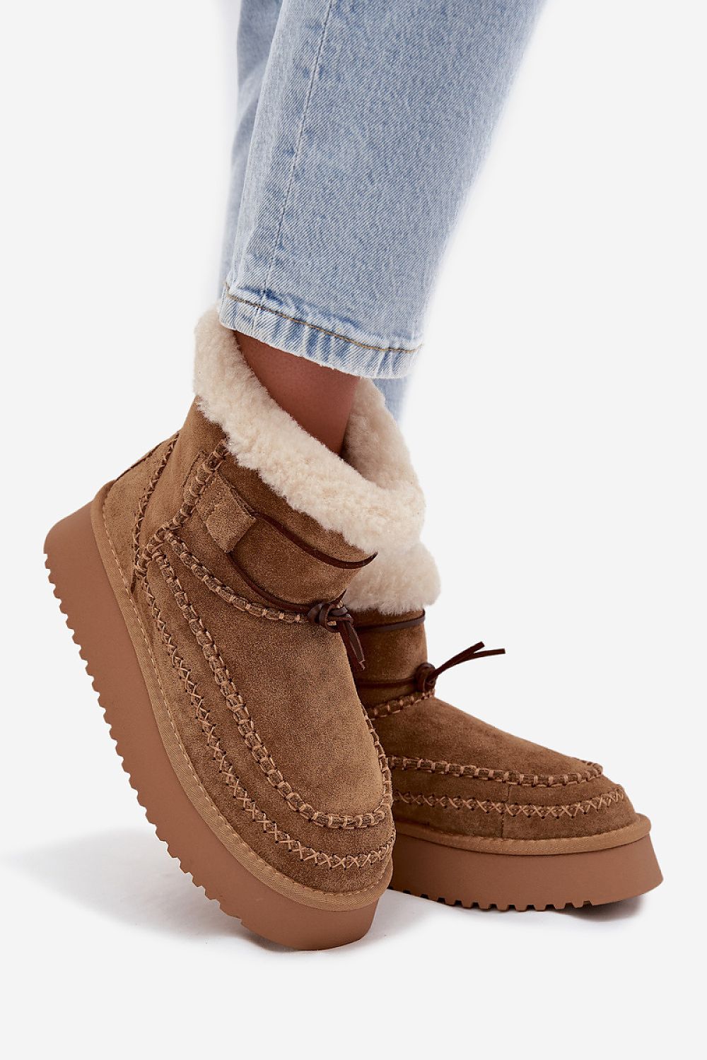 Fashion-forward Step in Style women's snow boots in suede, designed for both urban and outdoor adventures with superior insulation.