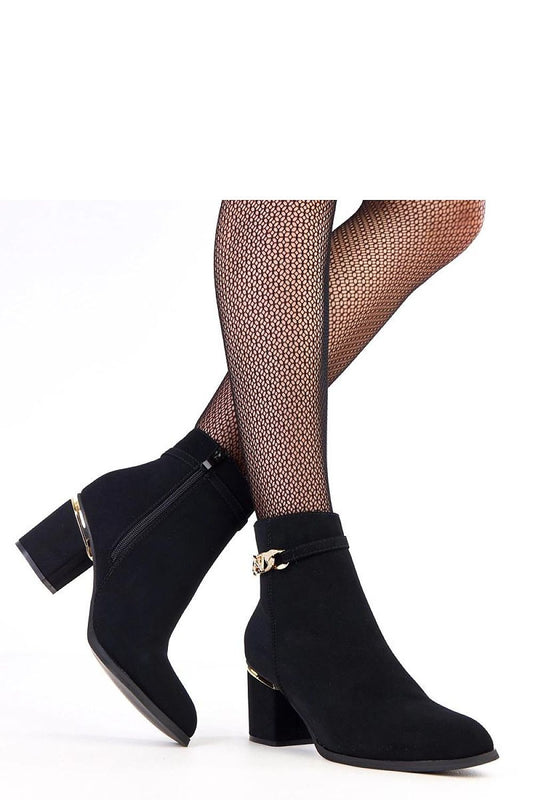 Close-up of the stunning gold zircon ornament on Solea's sophisticated ankle boots, blending classic style with modern elegance.