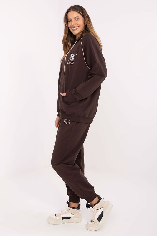 Close-up of the sophisticated embroidery and subtle zircons on the hoodie of the elegant tracksuit set by Relevance, showcasing luxury and style.