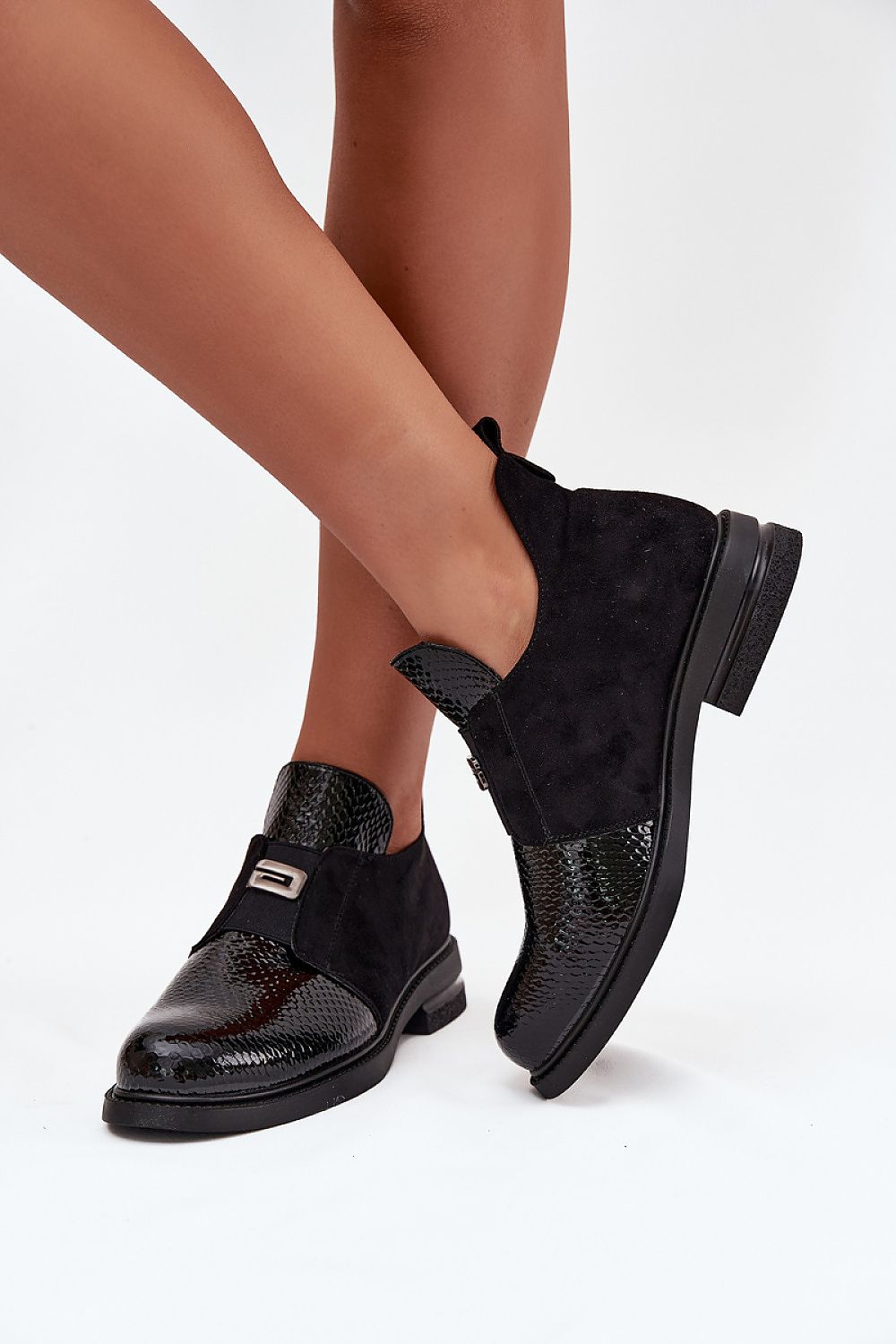 Close-up view of Vinceza Women's ankle boots crafted from eco leather and suede, showcasing intricate texture details and a chic low heel. A premium choice for stylish footwear by Step in Style.