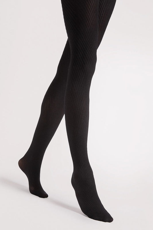 Close-up of Fiore Warm Matte Tights fabric detail emphasizing luxurious, subtle texture and sophisticated elegance.