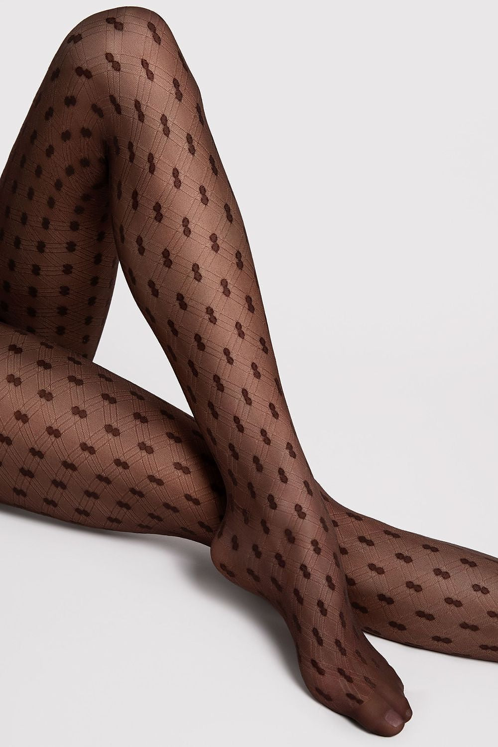 Elegant Bijou 20 Den Polka Dot Tights by Fiore in autumnal brown, perfect for an elegant outfit accent, highlighting sensuality and class.