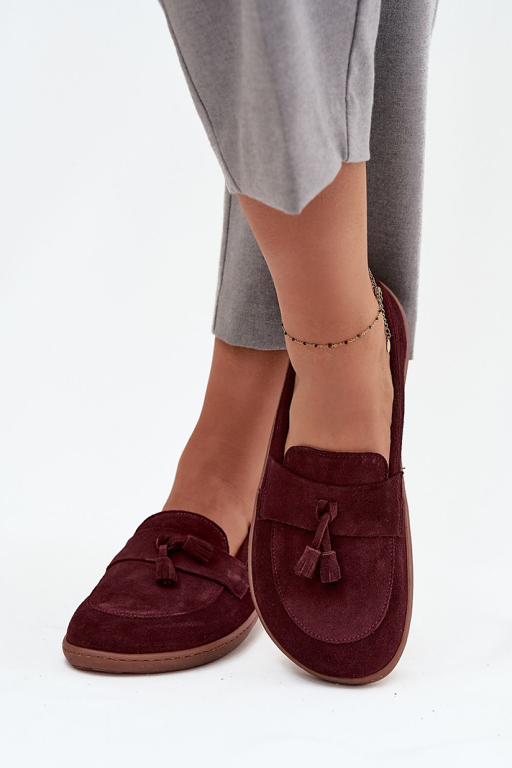 Close-up of Step in Style suede moccasins with tassel detailing for women, highlighting their exquisite craftsmanship and comfort.