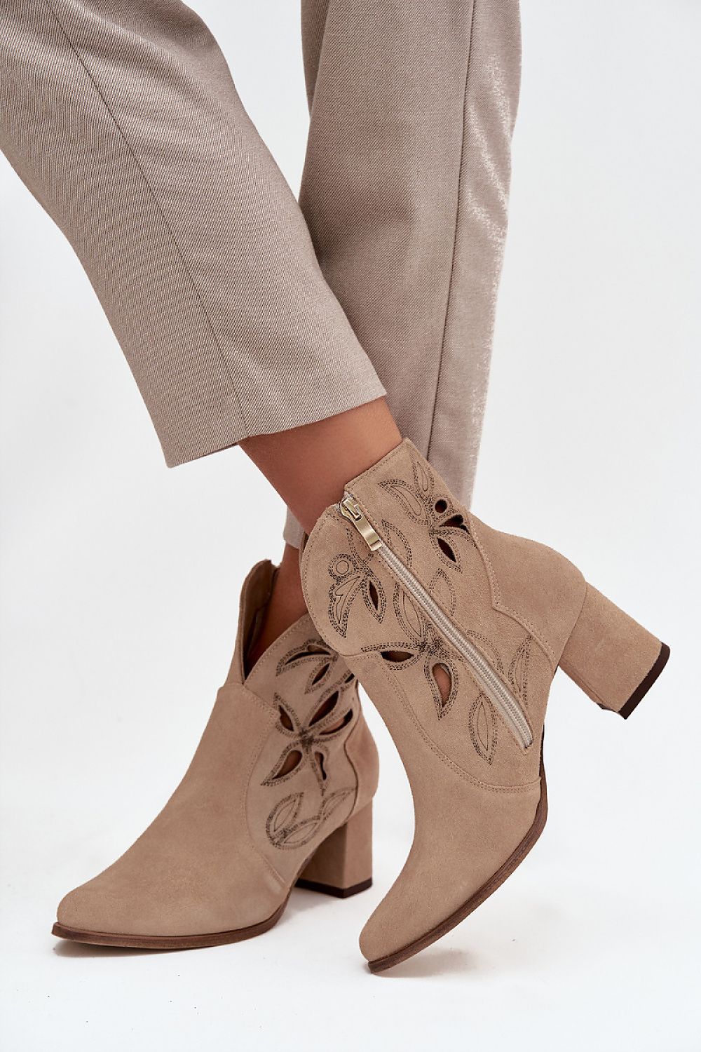Luxury women's ankle boots by Step in Style, crafted from natural leather with elegant pointed toes and stable column heels, perfect for sophisticated outfits. Available in sizes EU 35-43.