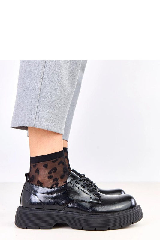 Close-up of Solea women's platform shoes, highlighting the high-quality synthetic leather finish and natural leather insole, perfect for a luxurious and breathable fit.