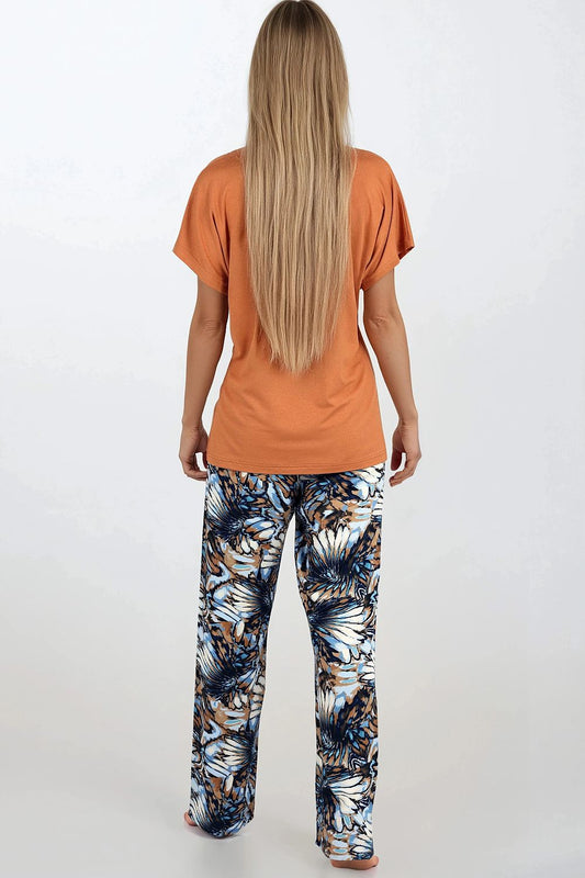 Luxury women's pajama set by Momenti Per Me, featuring a soft viscose 2-piece outfit designed for comfort and elegance, perfect for stylish bedtime relaxation.