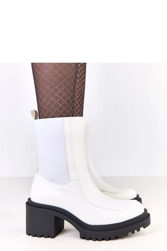 Close-up of Solea eco-leather ankle boots showcasing the warm interior and durable synthetic insole for all-day comfort.