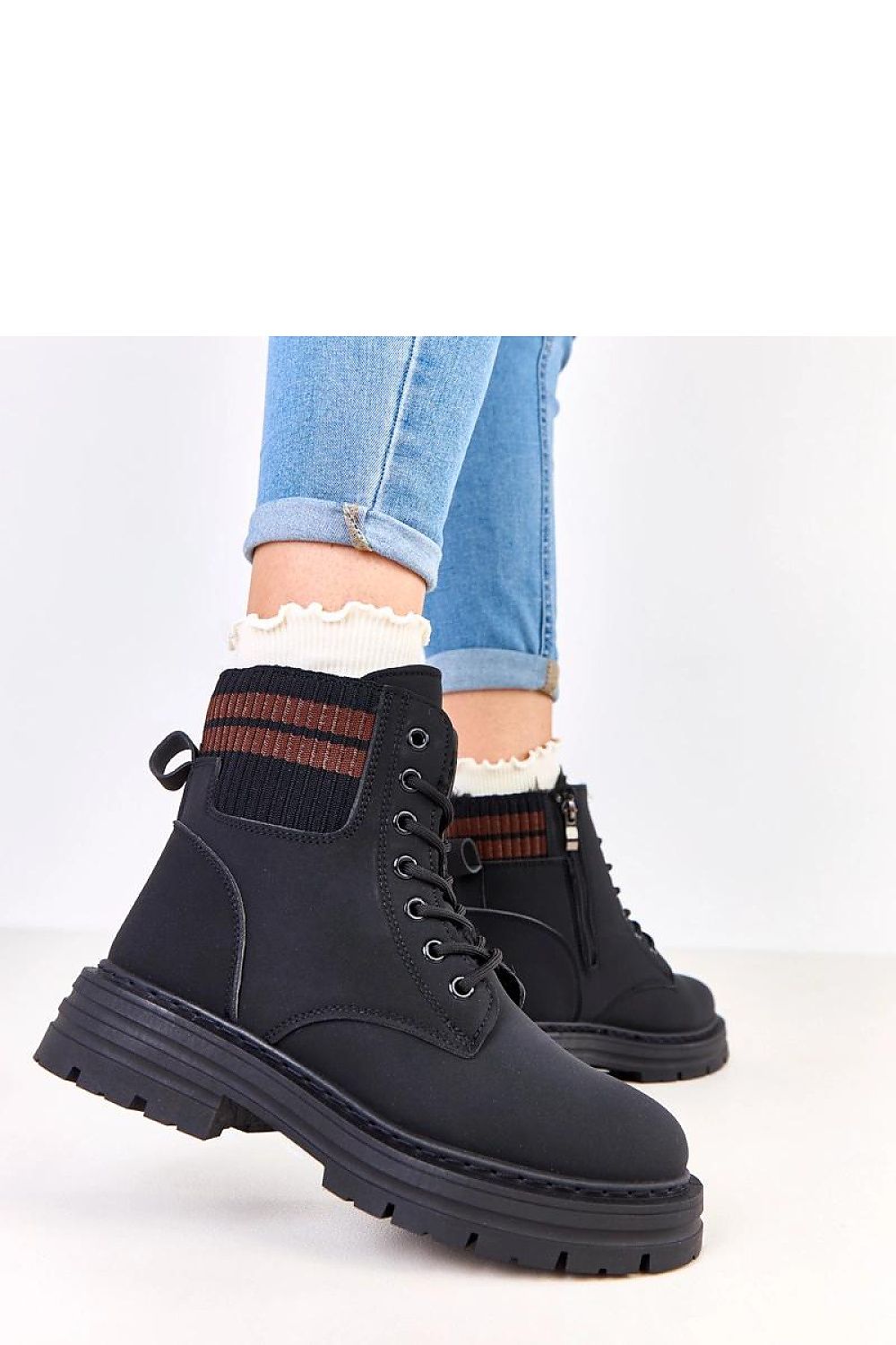 Solea Women's Insulated Trapper Boots in a fashionable urban setting, displaying their round toe, lacing system, and chic design.