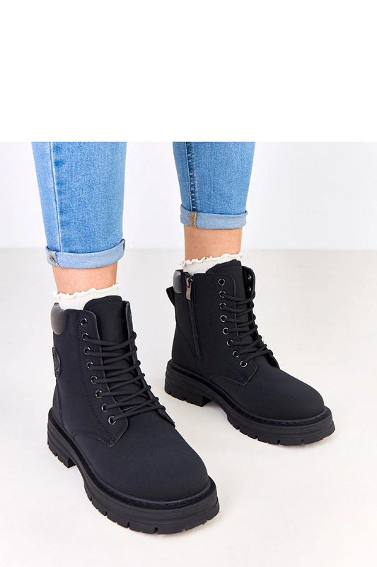 Luxury women's winter boots by Solea featuring stylish fur lining and a modern matte synthetic leather finish, perfect for chilly weather.