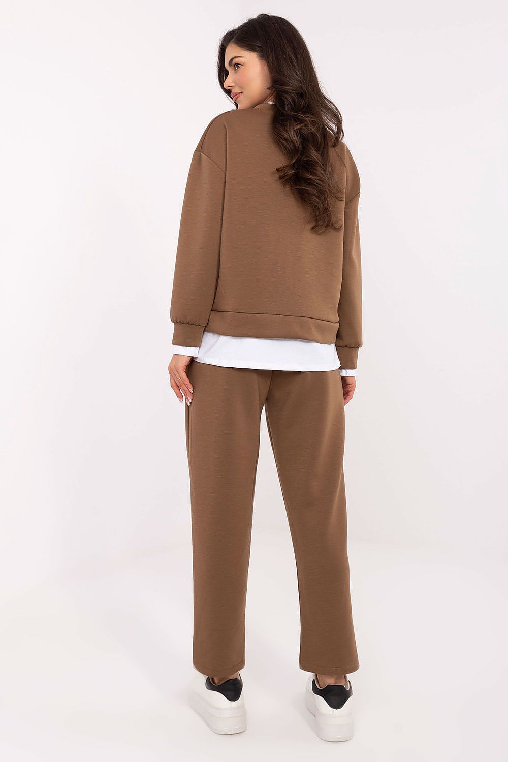 Elegant luxury women's athleisure set by Rue Paris, featuring comfortable high-waisted trousers and a chic hoodie for a fashionable everyday look.