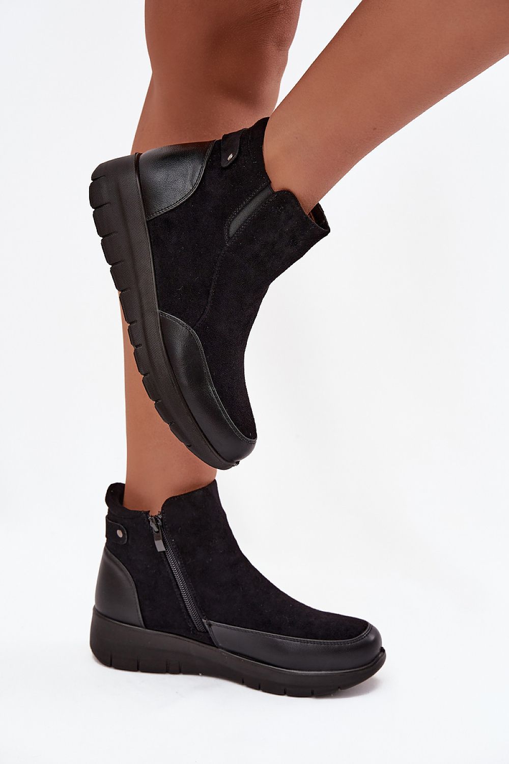 Exquisite women's ankle boots with fur lining and eco-friendly materials by Step in style, featuring a trendy platform and zipper, ideal for stylish winter attire.