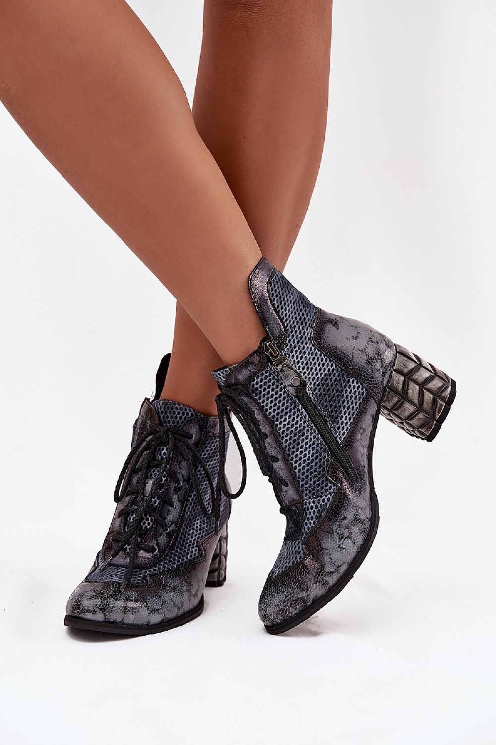 Stylish ankle boots in natural leather with lacing and zipper by Step in Style, designed for comfort and a flattering silhouette.