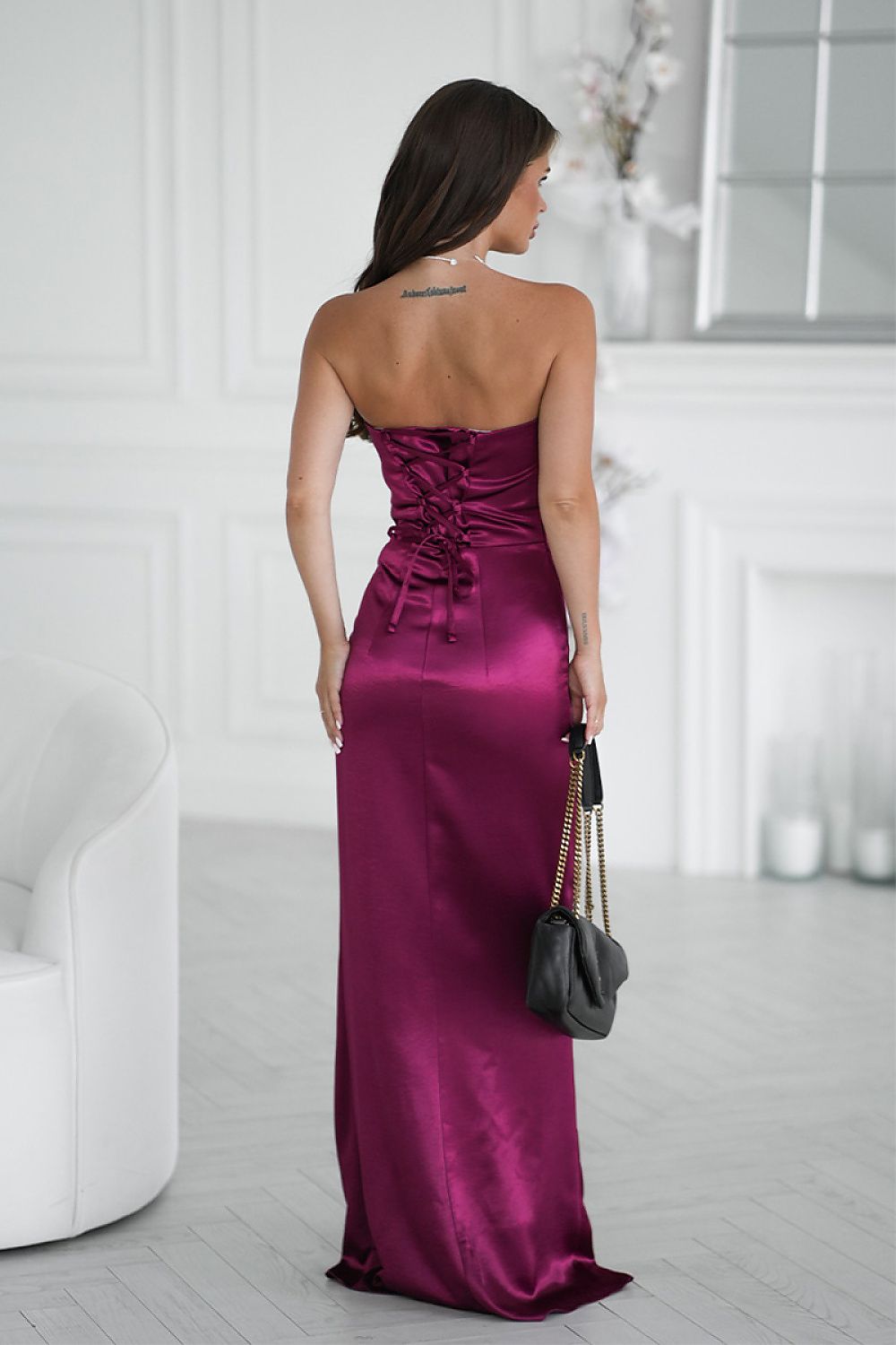 Full length view of an elegant Bicotone strapless satin long dress, highlighting its flattering silhouette and sophisticated high slit for glamorous events.