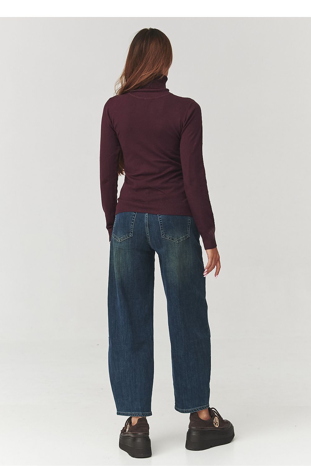 Luxurious Makadamia women's turtleneck golf top in a soft viscose blend, perfect for stylish outfits, available in versatile colours, highlighting feminine elegance.