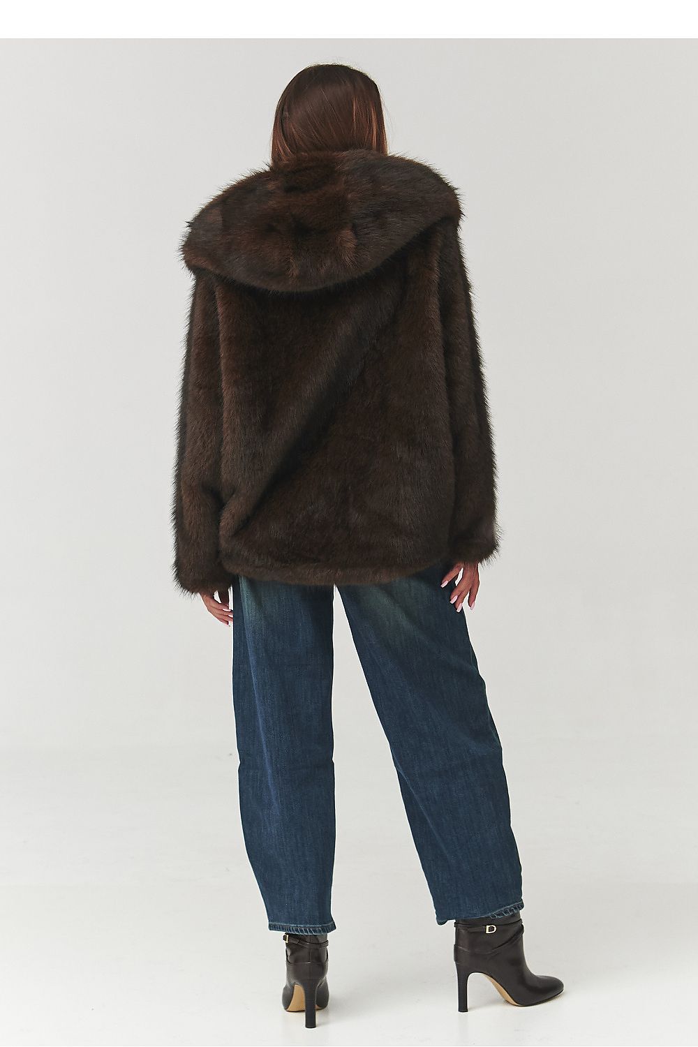 Stylish Makadamia luxury faux fur jacket in deep brown, designed for comfort and elegance, ideal for trendy casual and evening wear.