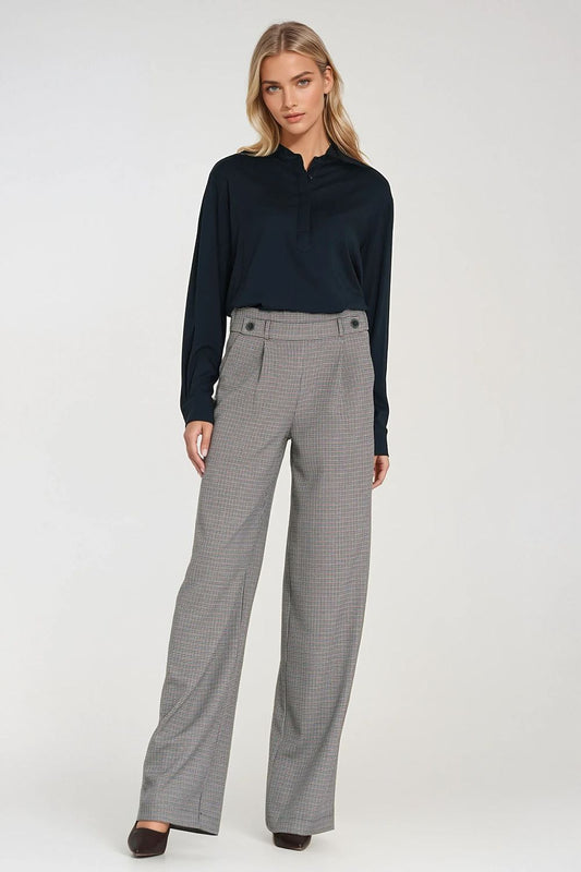 Wide leg women's trousers by Nife, showcasing a luxurious high-waist silhouette with decorative buttons and relaxed fit for a chic look.
