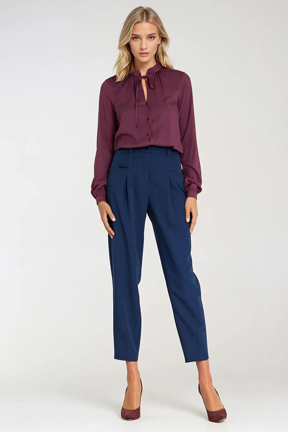 Model wearing Nife stylish long sleeve blouse, exemplifying chic elegance in various sizes from EU 36 to 42, suitable for diverse occasions.