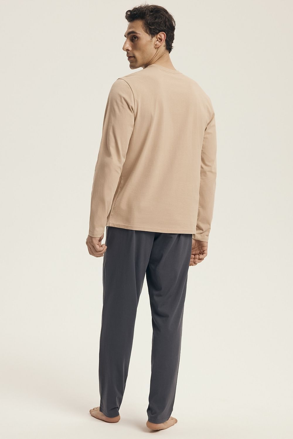 Elegant Henderson men's pajama set showcasing a round neckline shirt and wide waistband trousers, perfect for achieving a luxurious and comfortable nightwear experience.