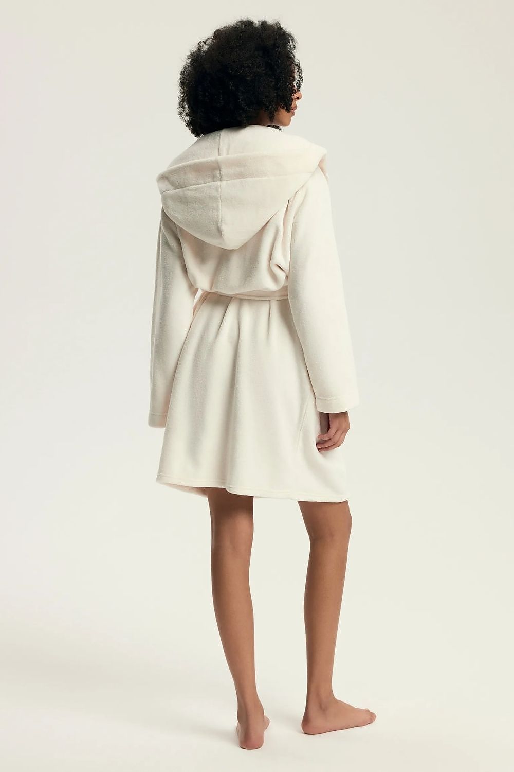 Stylish knee-length women's bathrobe by Henderson, crafted from 100% polyester for ultimate comfort.