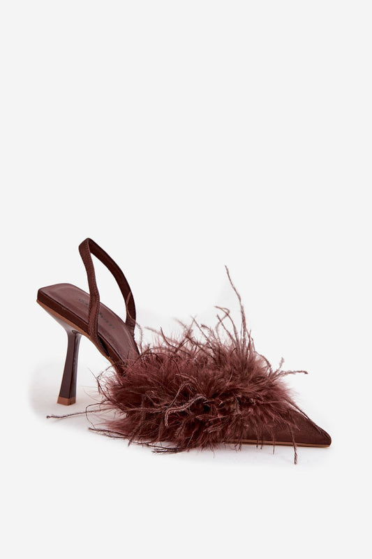 Close-up of Step in Style's women's high heels adorned with delicate feathers, showcasing the exquisite design and craftsmanship ideal for stylish occasions.