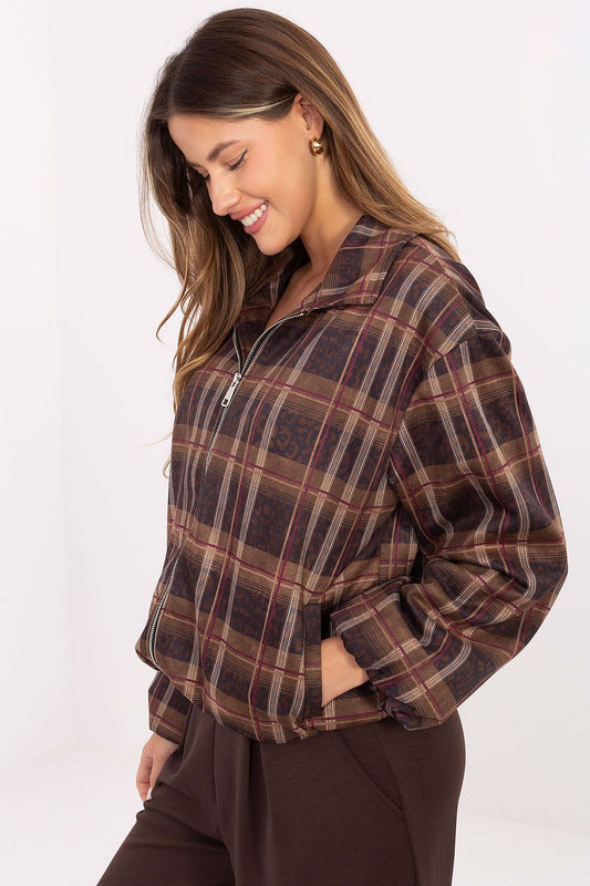 Close-up of the intricate animal print and check pattern on Rue Paris women's jacket, showcasing luxury and sophisticated design.