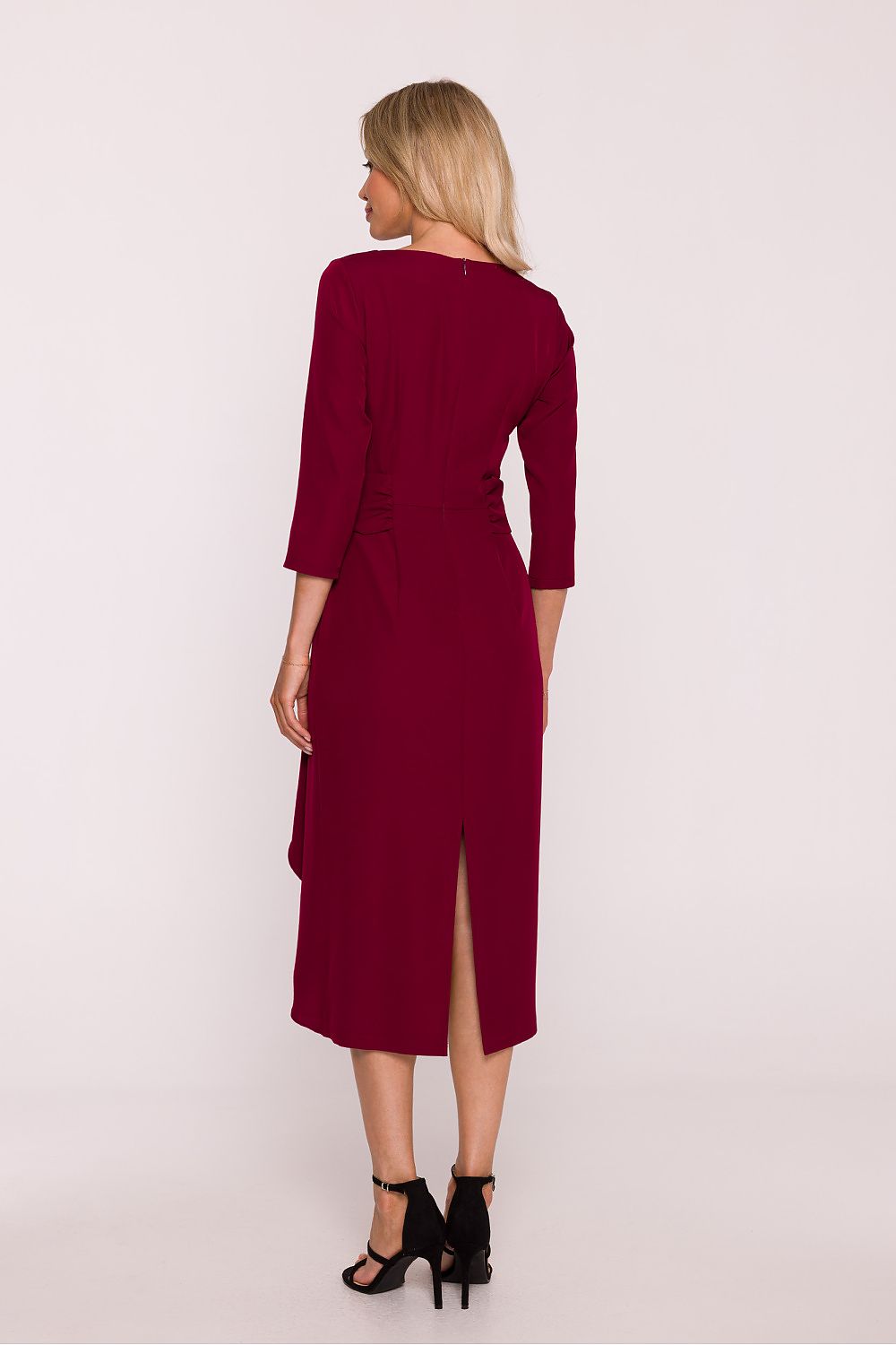 Rear view of the Elegant Frill Cocktail Dress by Stylove highlighting the high slit and covered zipper for an elegant finish.