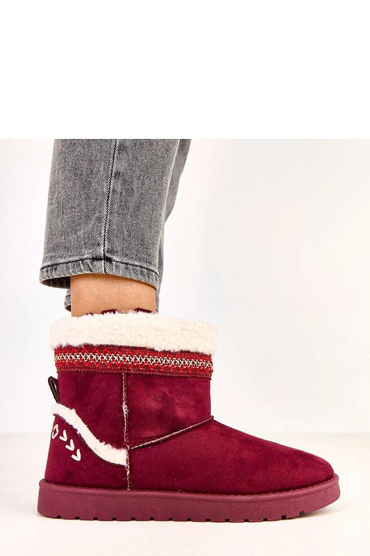 Close-up view of Solea's slip-on snow boots showcasing the elegant ecological suede leather and detailed embroidery perfect for winter functionality.