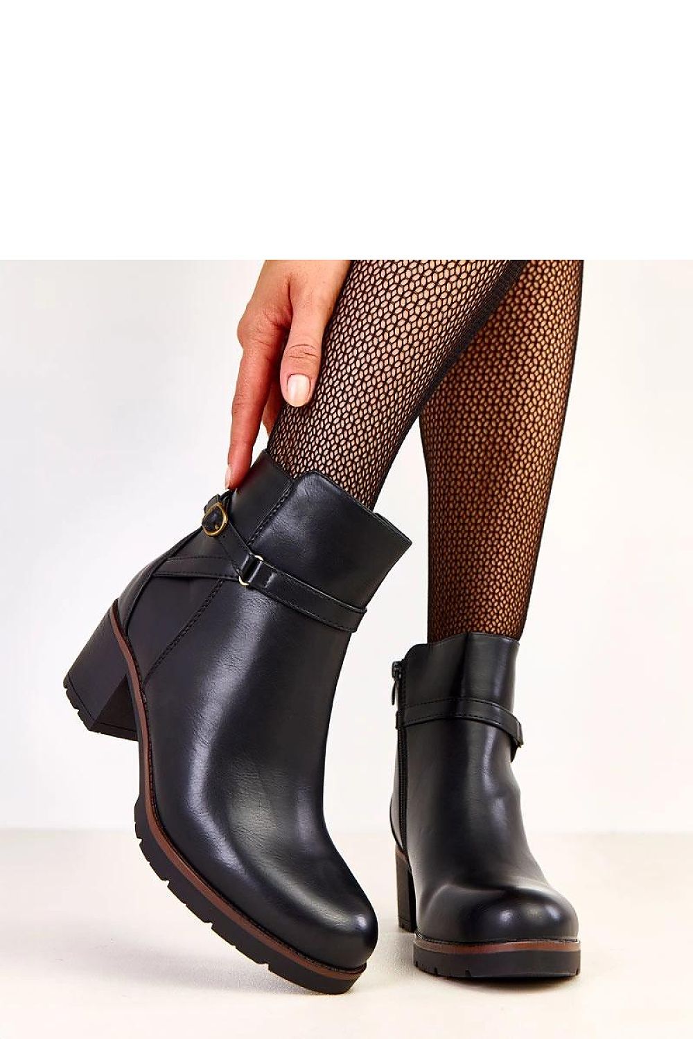 Solea insulated ankle boots displayed on a stylish surface, highlighting their ecological leather and elegant 12.5 cm upper design.