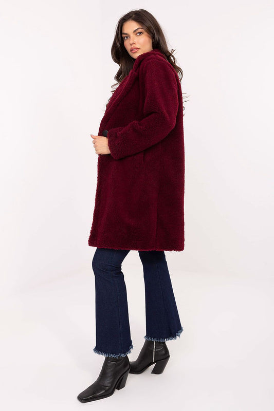Luxurious knee-length women's coat in soft polyester, designed for urban elegance, produced by Factory Price, featuring a button closure and slip pockets.
