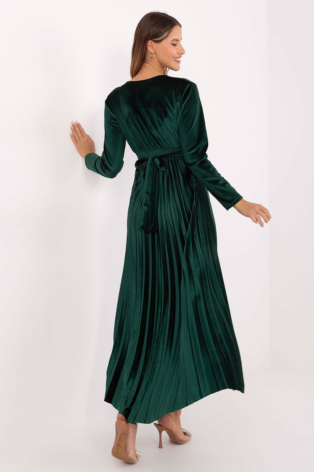 Full view of the Italy Moda elegant long maxi dress, featuring long sleeves, a flattering waist cutout, and a flowing pleated bottom ideal for evening parties.