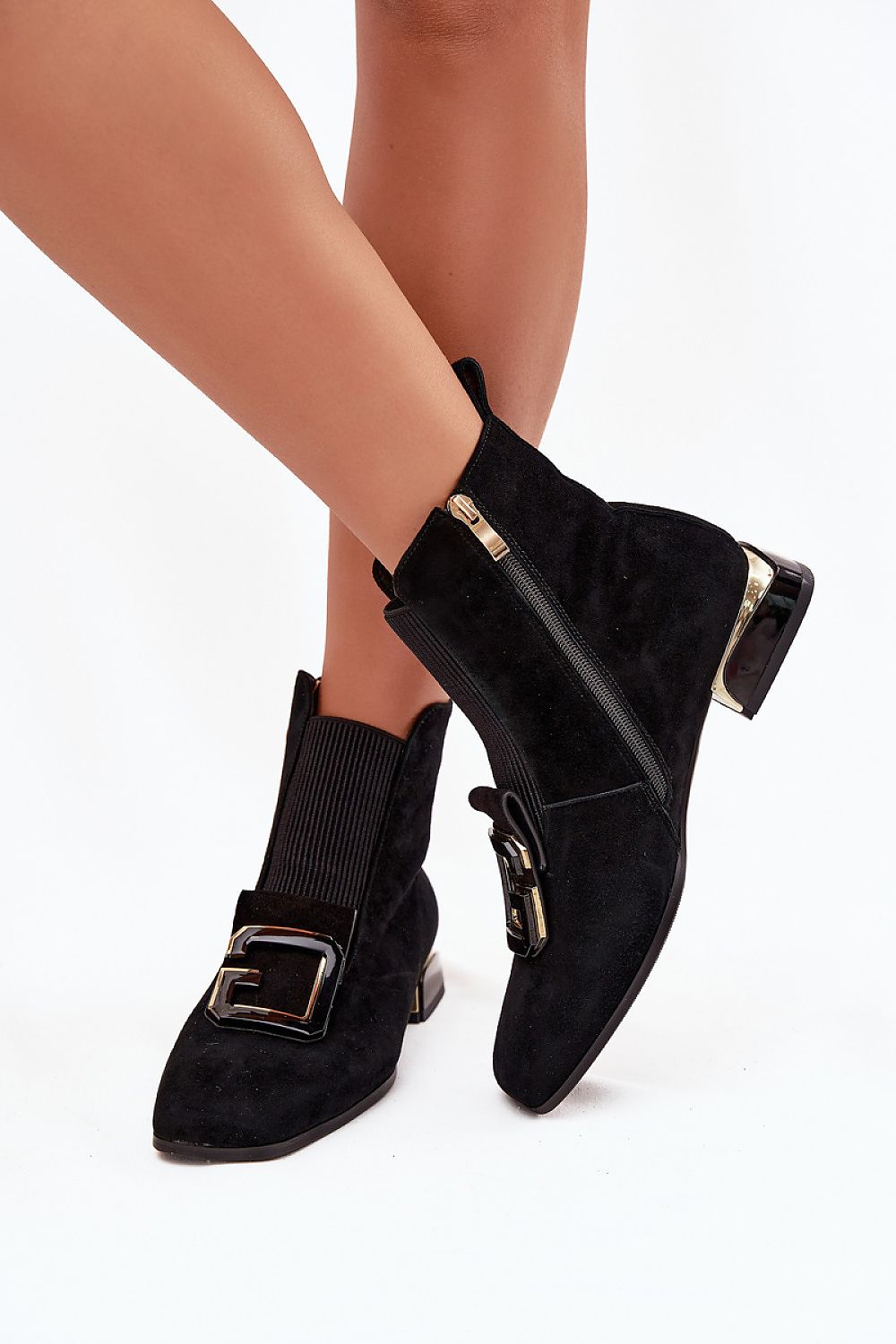 Luxury women's low-heeled ankle boots from Step in Style, crafted from high-quality suede with a side zipper for effortless style and comfort.