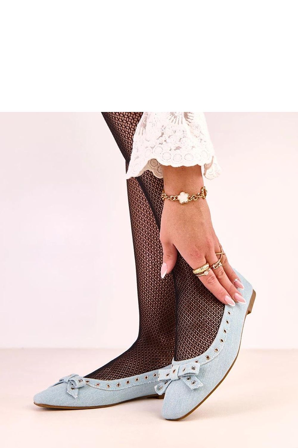 Solea Denim Ballet Flats elegantly styled on a model, demonstrating versatility in both casual and formal outfits with a touch of luxury.