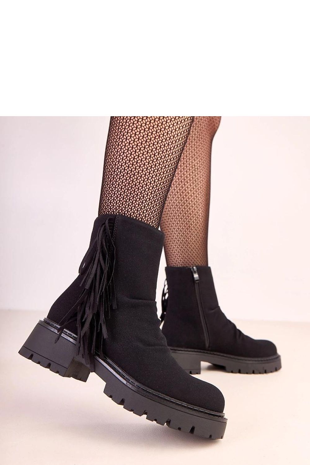 Sophisticated Solea ankle boots with a thick sole and round toe design, combining luxurious aesthetics with practicality.