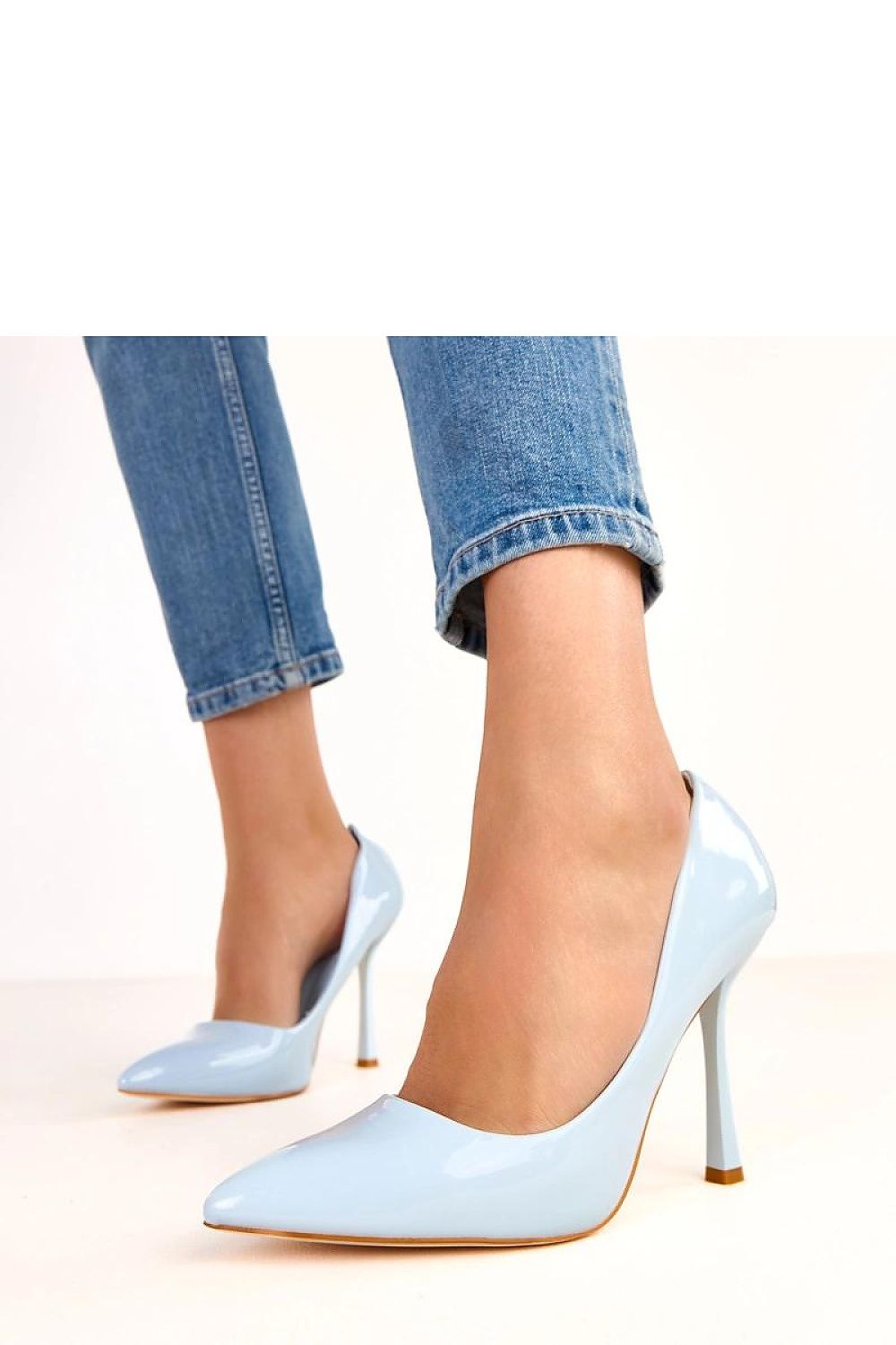 Solea High Heels displayed with a stylish outfit, designed for enhancing feminine elegance with a chic pointed toe and comfortable slip-on style.