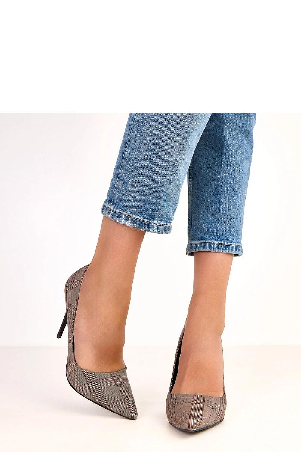 Close-up of Solea slip-on high heels showcasing the exquisite craftsmanship, pointed toe design, and luxurious fabric, ideal for impeccable fashion statements.