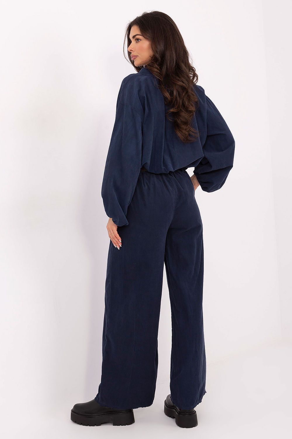 Stylish women's high-waisted corduroy trousers by Italy Moda, displayed in a casual setting, highlighting the wide leg design and soft fabric for ultimate comfort.